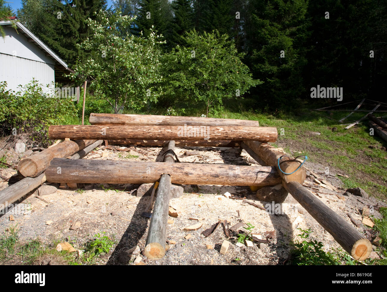 Foundation And Base Frame Of A Small Log Cabin Stock Photo