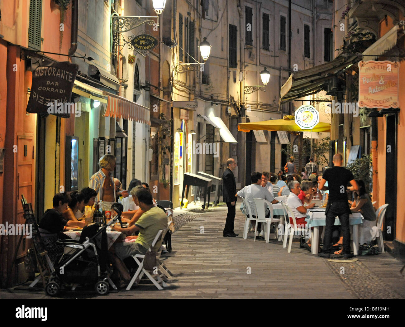 Restaurant, pedestrianised zone, night exposure, San Remo, Riviera dei Fiori, Liguria, Italy, Europe Stock Photo