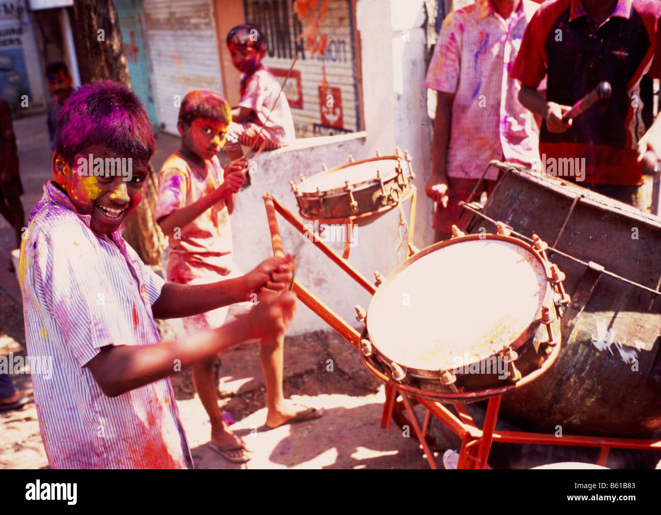 boy playing drums, holi festival, India Stock Photo - Alamy
