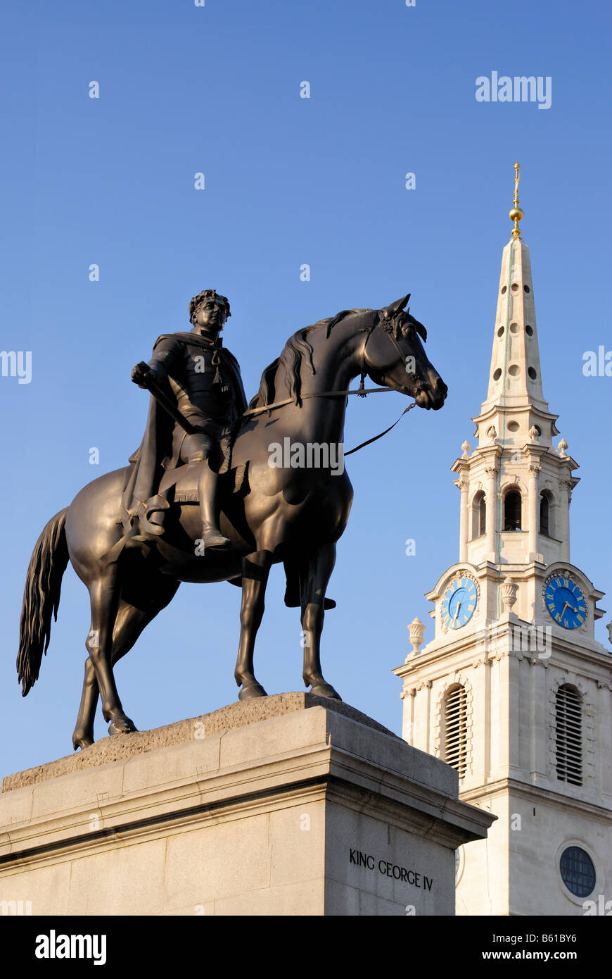 The Statue of King George 4th stands in Trafalgar Square. The church of St. Martin-in-the-Fields stands behind it. Stock Photo