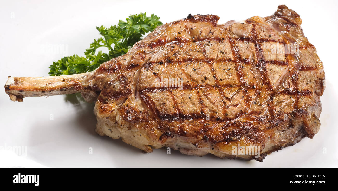 Rib Eye steak on the bone with white background Stock Photo Alamy