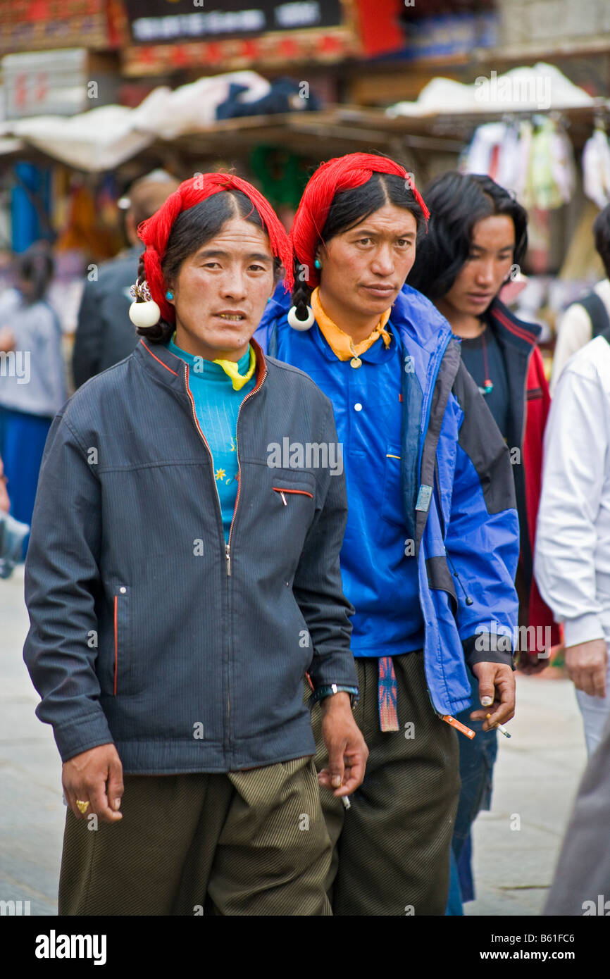 Khampas Tibetan men from the Kham region wearing characteristic red
