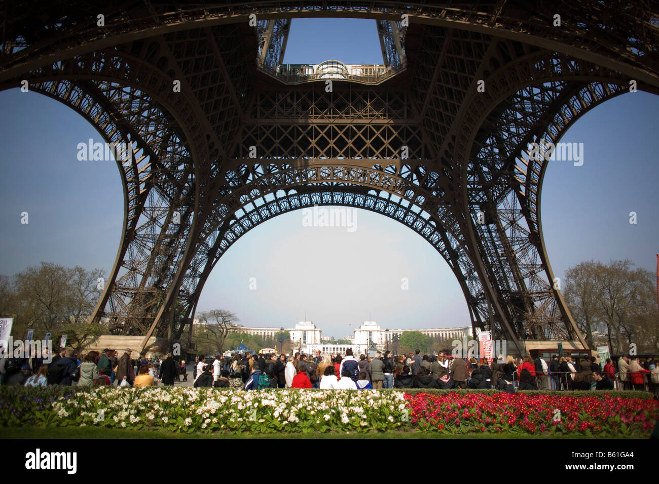 Visitors to the Eiffel Tower observe Paris’ iconic structure Stock
