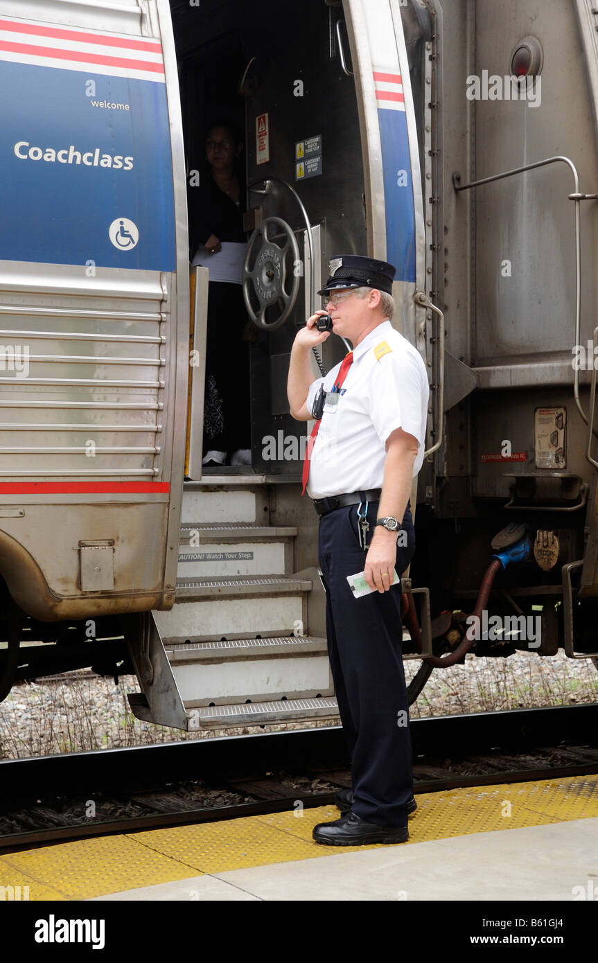 Amtrak railroad conductor communicating with train driver America USA