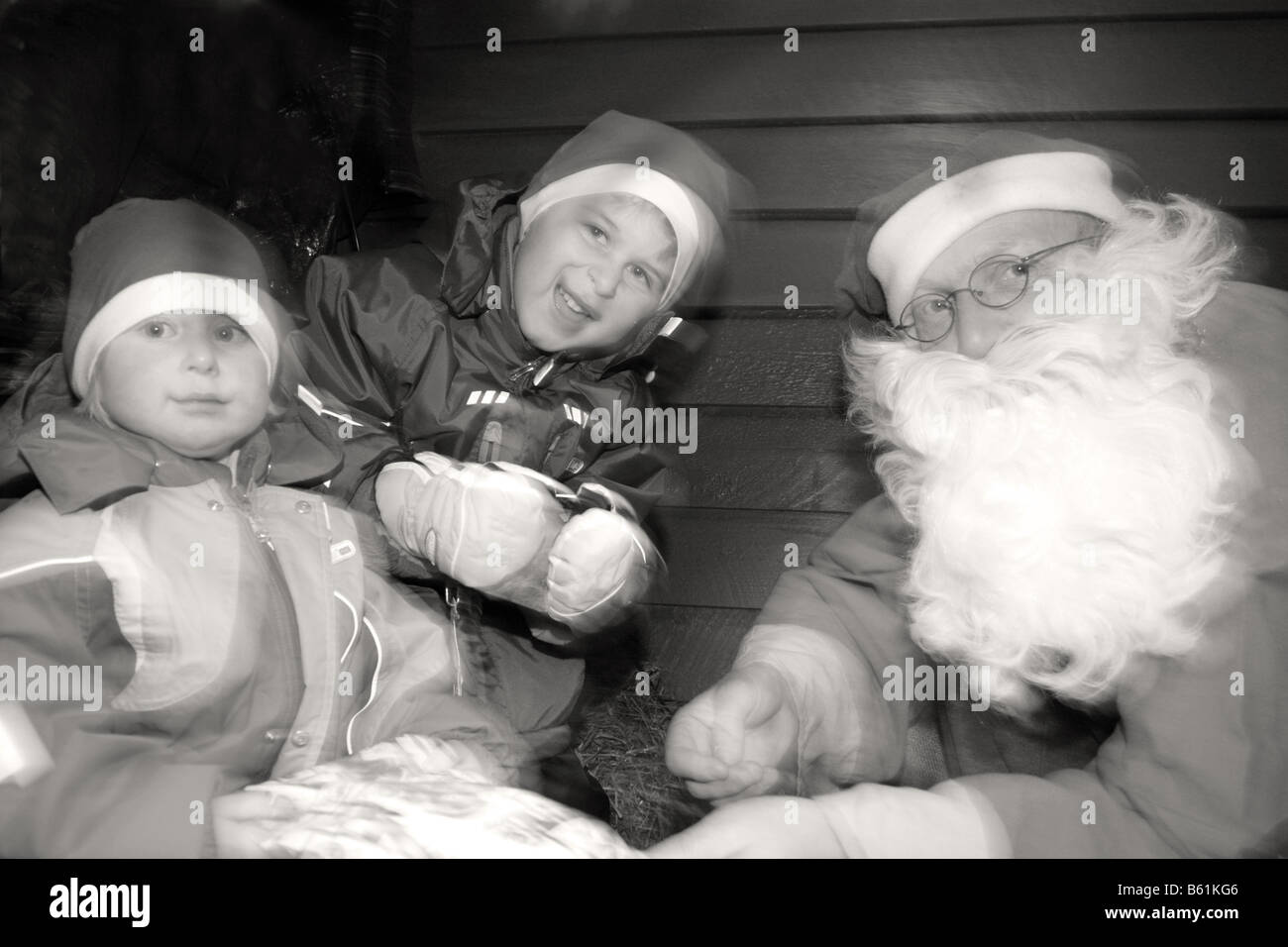 swedish santa claus with beard giving happy children christmas presents ...