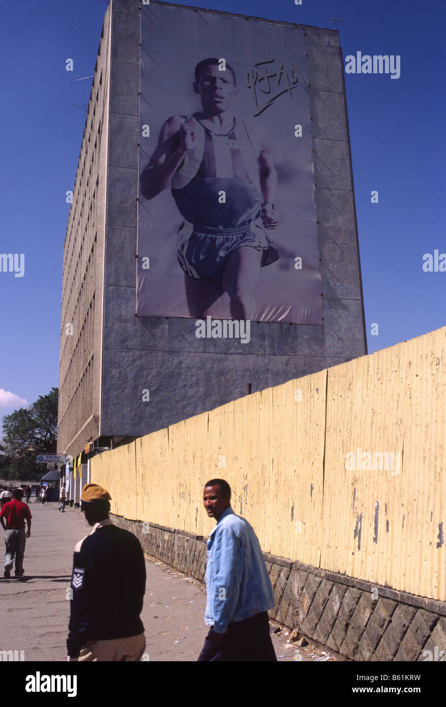 An giant poster hangs on a building of the long distance runner and national hero of Ethiopia Haile Gabre Selassie Stock Photo