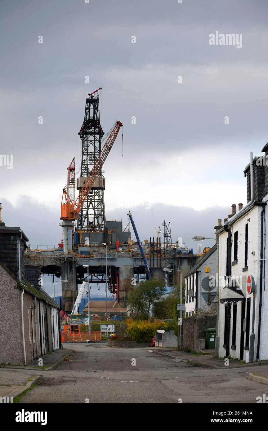 Ocean Princess Oil Exploration platform and Extraction Rig, Houses in Invergordon dockland street, Cromarty Firth, Scotland, uk Stock Photo