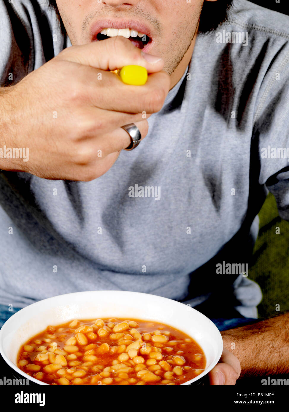 Young man eating beans model hires stock photography and images Alamy