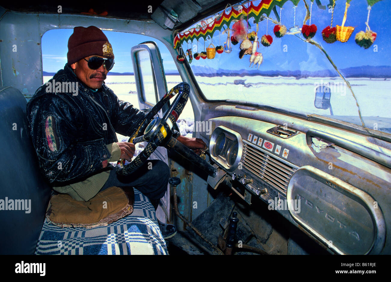 After three days of work in the Uyuni salt flat Inocencio Flores  back to Colchani in his truck. Bolivia. Stock Photo