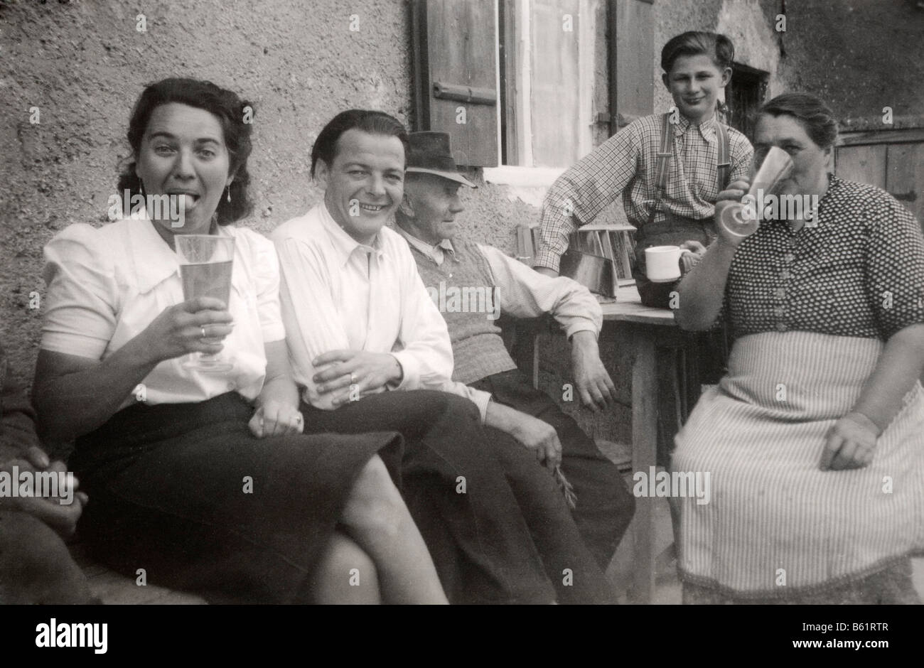 Historical photo, people sitting in front of a house, drinking, 1944 Stock Photo