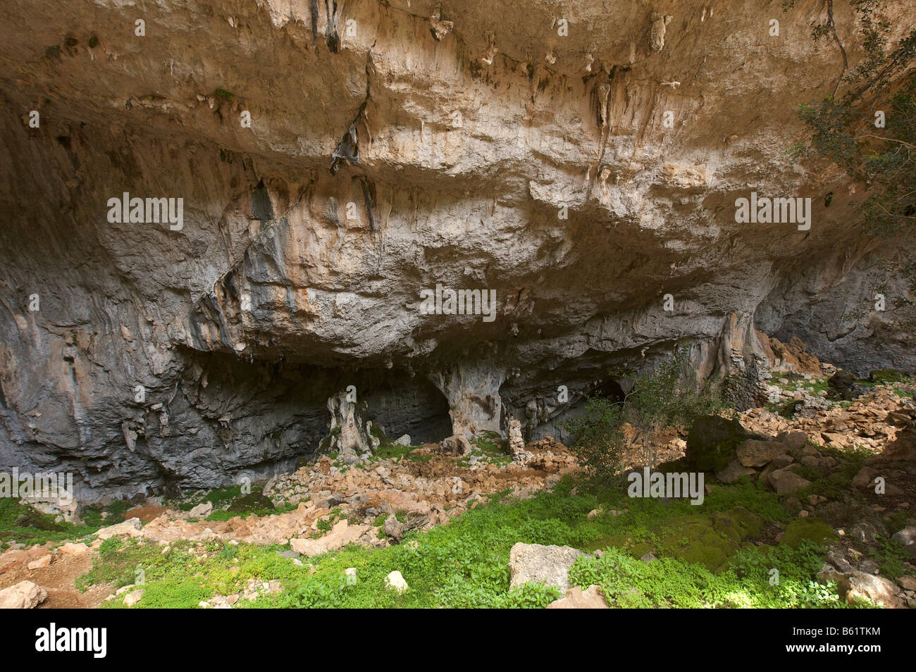 Nuraghic Village in a collapsed sinkhole on Monte Tiscali in the Gennargentu National Park between Dorgali and Oliena, Sardinia Stock Photo