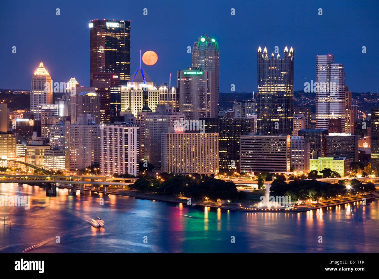 Moon rising over skyline of Pittsburgh Pennsylvania Stock Photo