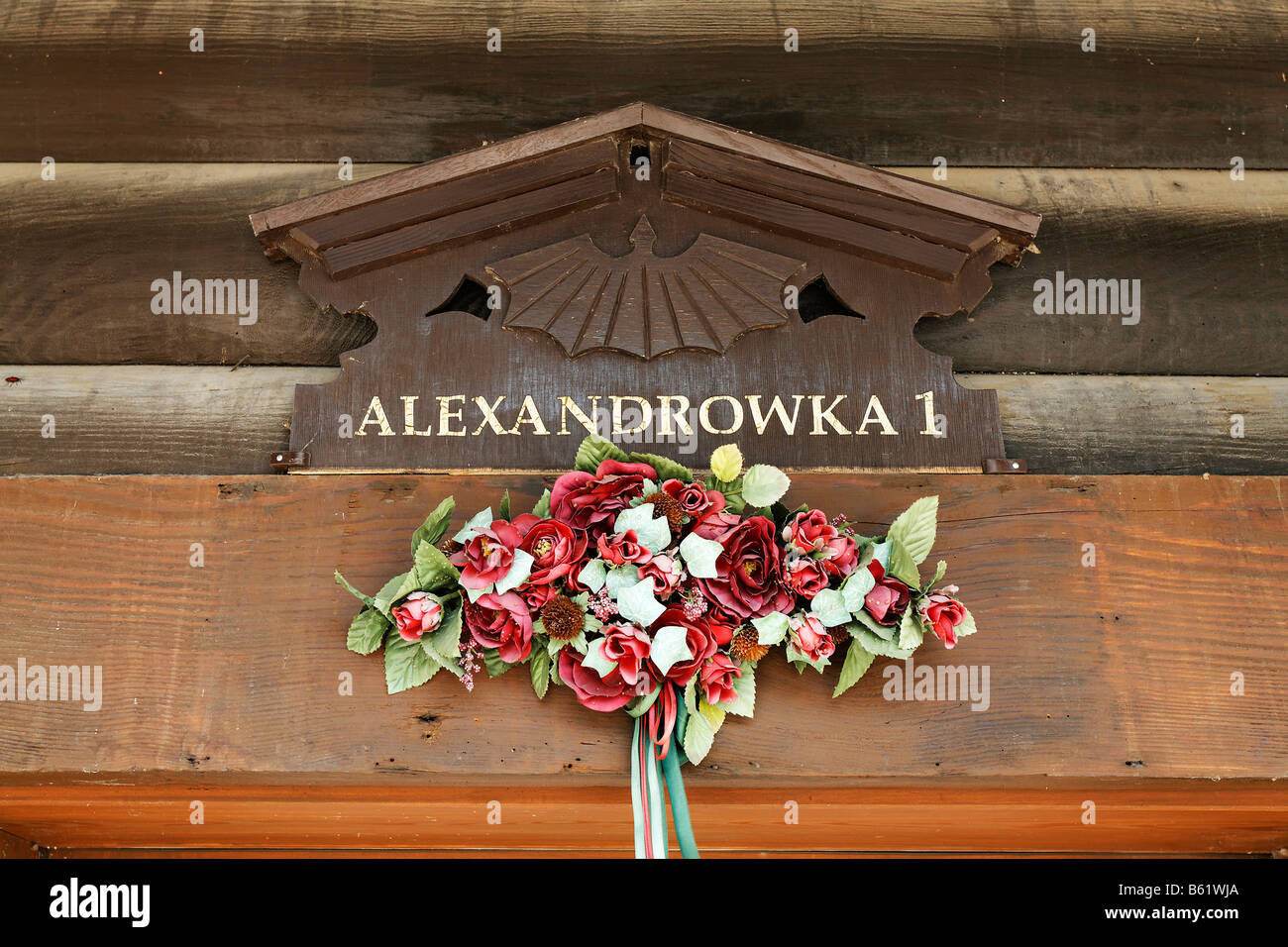 Carved house sign Alexandrowka 1, decorated with fake flowers, detail, Russian colony, Alexandrowka, Potsdam, Brandenburg, Germ Stock Photo