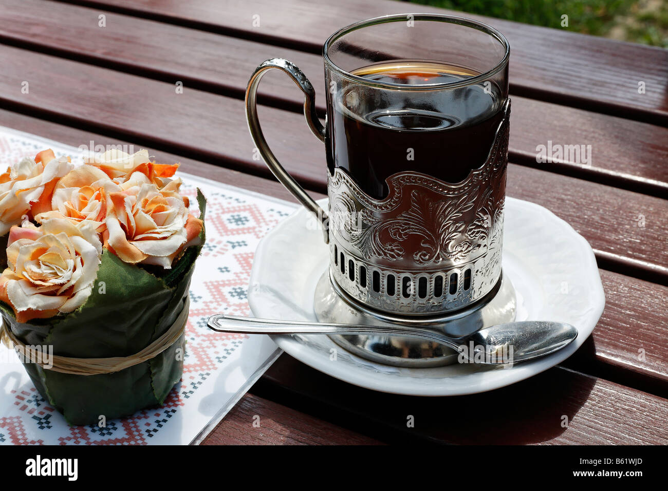 Glass Of Tea In A Beautiful Metal Holder On A Wooden Table