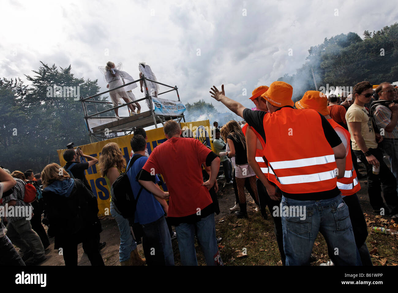 Loveparade 2008, people in front of a platform with go-go dancers, Dortmund, Ruhr district, North Rhine-Westphalia, Germany, Eu Stock Photo