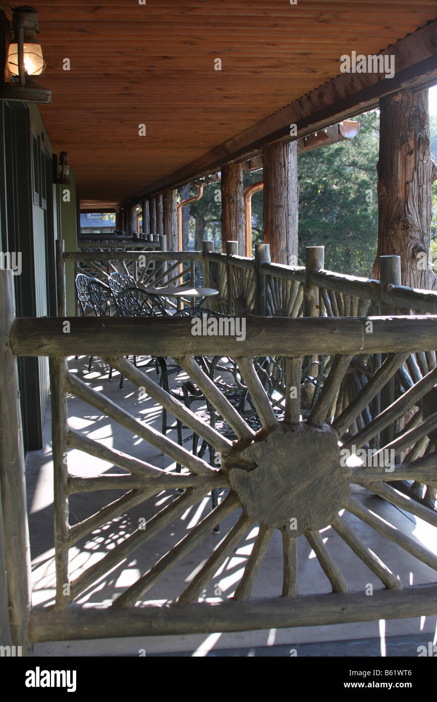 Hotel balconies and rustic furniture for rooms on second floor in
