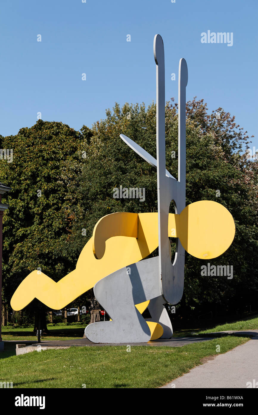 Little man jumping head-first through the stomach of a second man, large metal sculpture by Keith Haring, Ludwig Gallery, Oberh Stock Photo