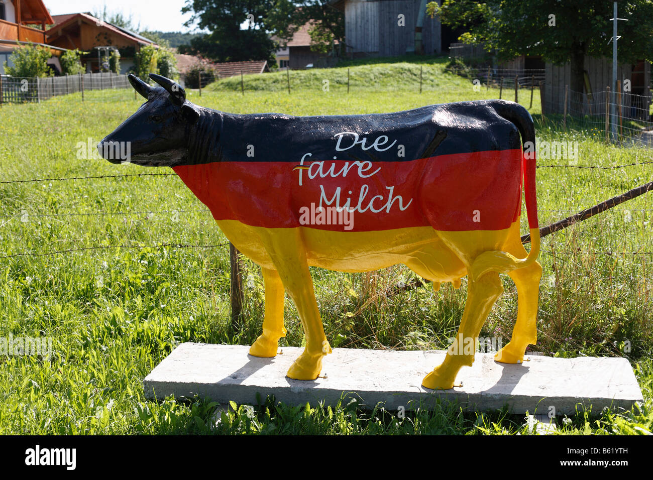 Sculpture of a cow painted in the national colours of Germany, 'fair cow' written on it, Marnbach, Upper Bavaria, Germany, Euro Stock Photo