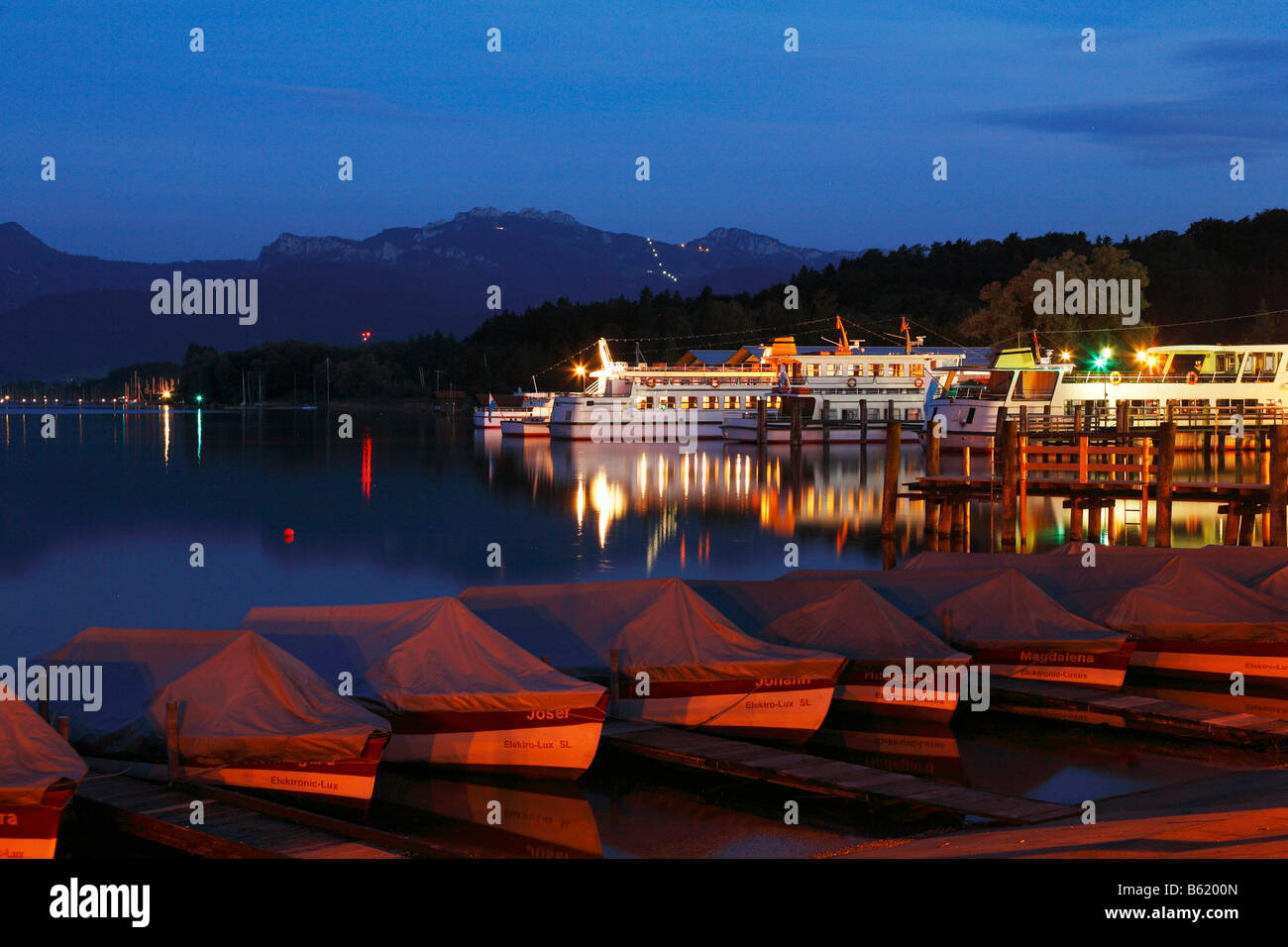 Night-time illuminated harbour in Prien, Chiemsee lake, Chiemgau, Upper Bavaria, Germany, Europe Stock Photo