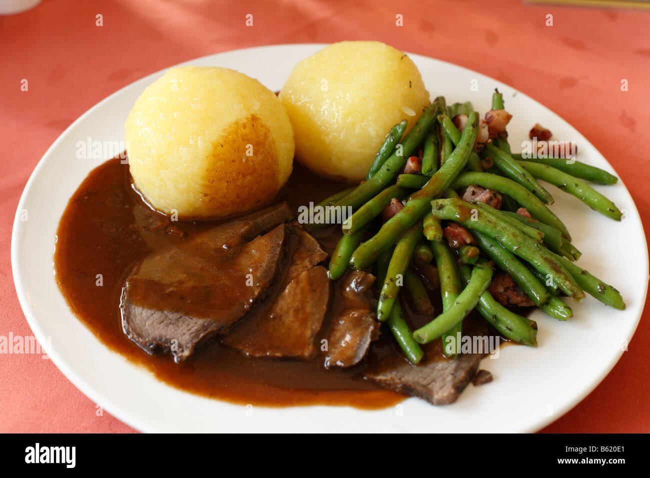 Thueringer Sauerbraten or Thuringian marinated beef served with green beans and dumplings, Rhoen, Thuringia, Germany, Europe Stock Photo