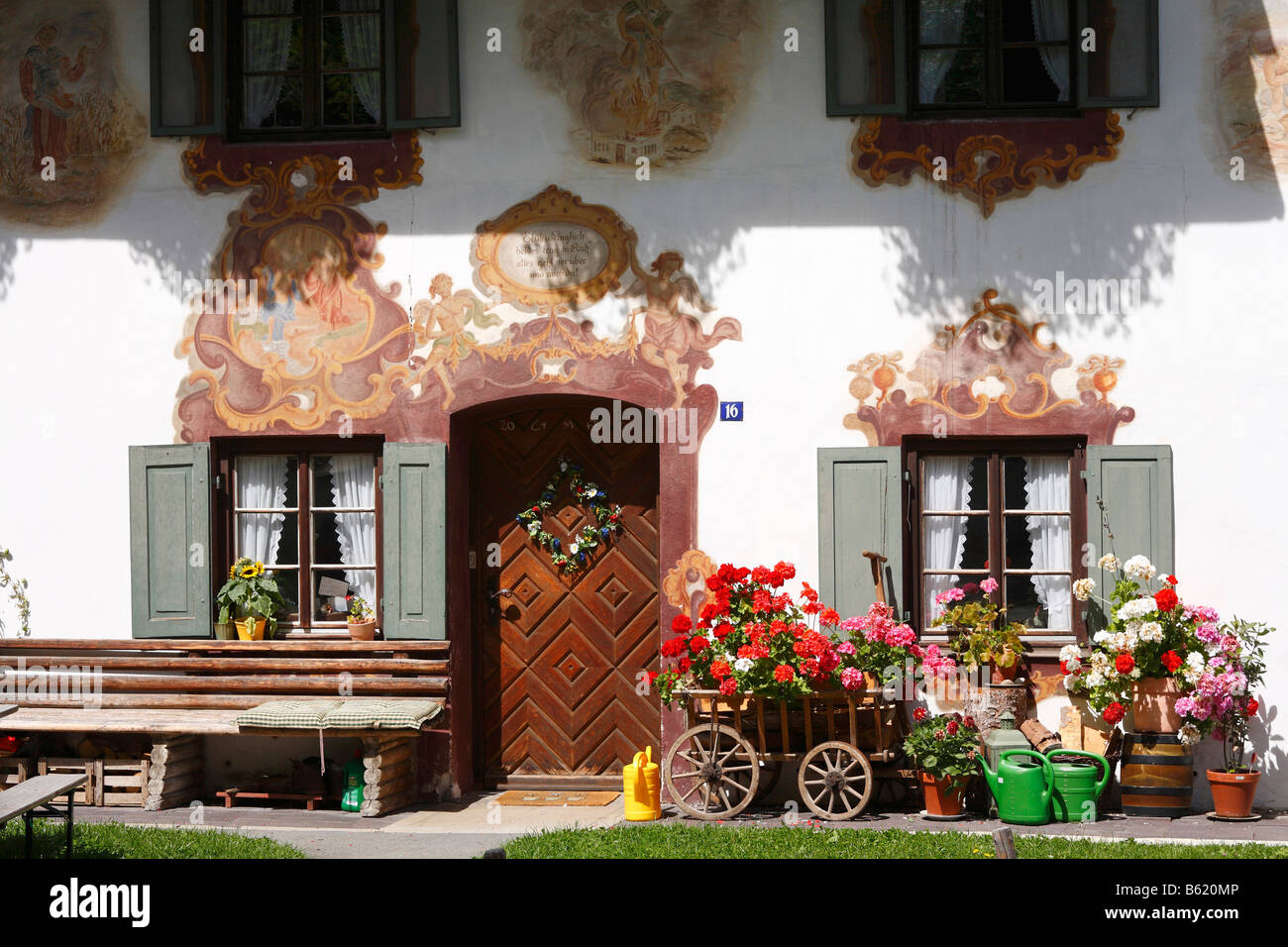 House with wall-painting and handcart, Oberammergau, Upper Bavaria, Germany, Europe Stock Photo