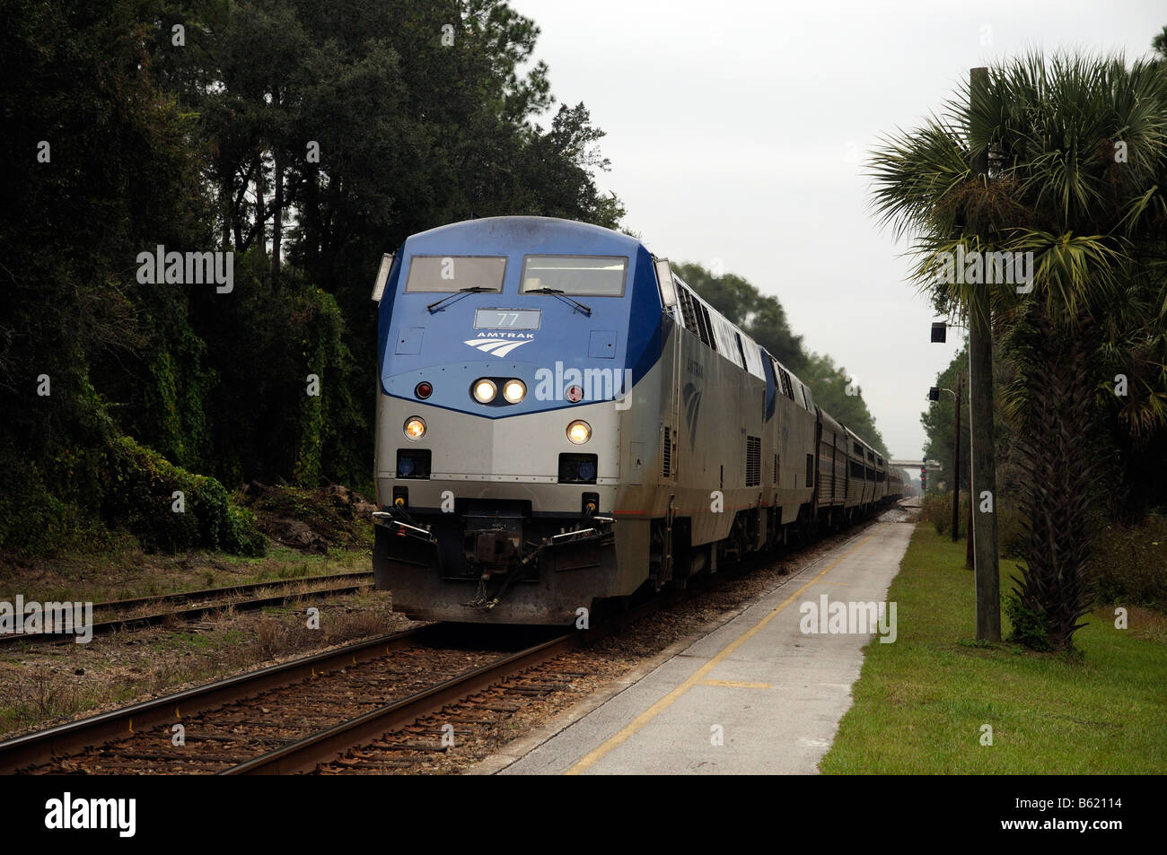 Amtrak passenger train approaching DeLand railroad station northern