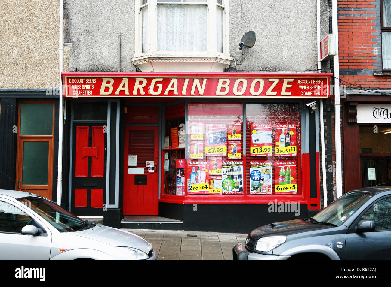 Typical bargain booze cheap alcohol drink shop retail store on UK town centre high street selling discounted alcoholic beverages Stock Photo