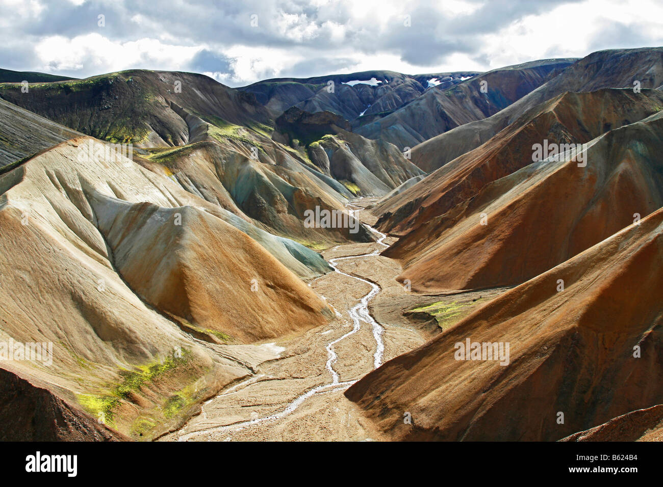 View into a river valley of the colourful Rhyolith Mountains of Landmannalaugar, Iceland, Europe Stock Photo