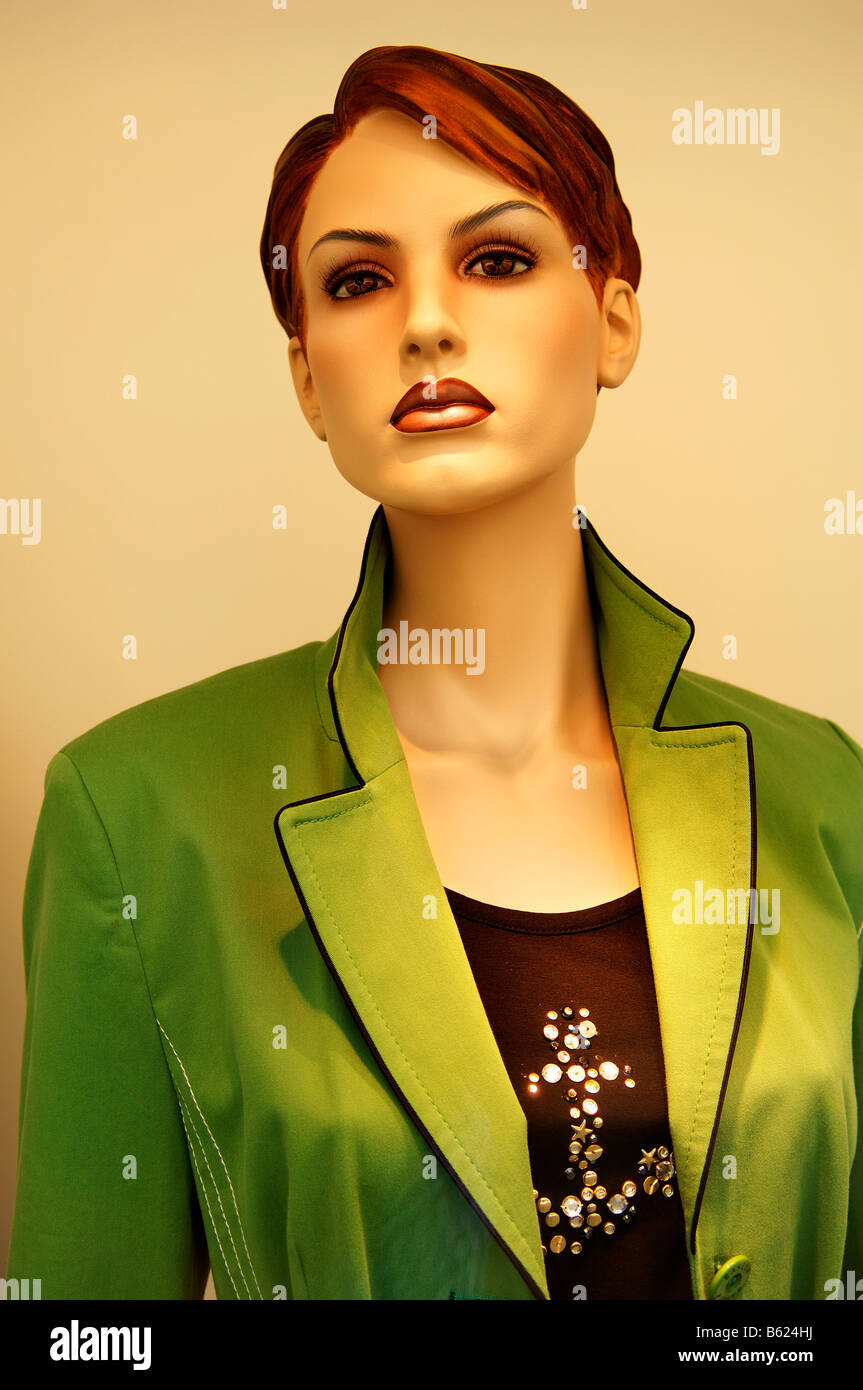Female shop window mannequin wearing a green jacket, Berlin, Germany, Europe Stock Photo