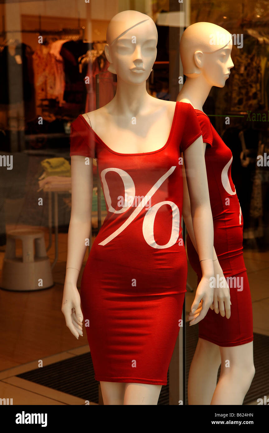 Two white shop window dolls mannequin wearing red dresses in the SSV, Summer Clearance Sales, Nuremberg, Middle Franconia, Bava Stock Photo