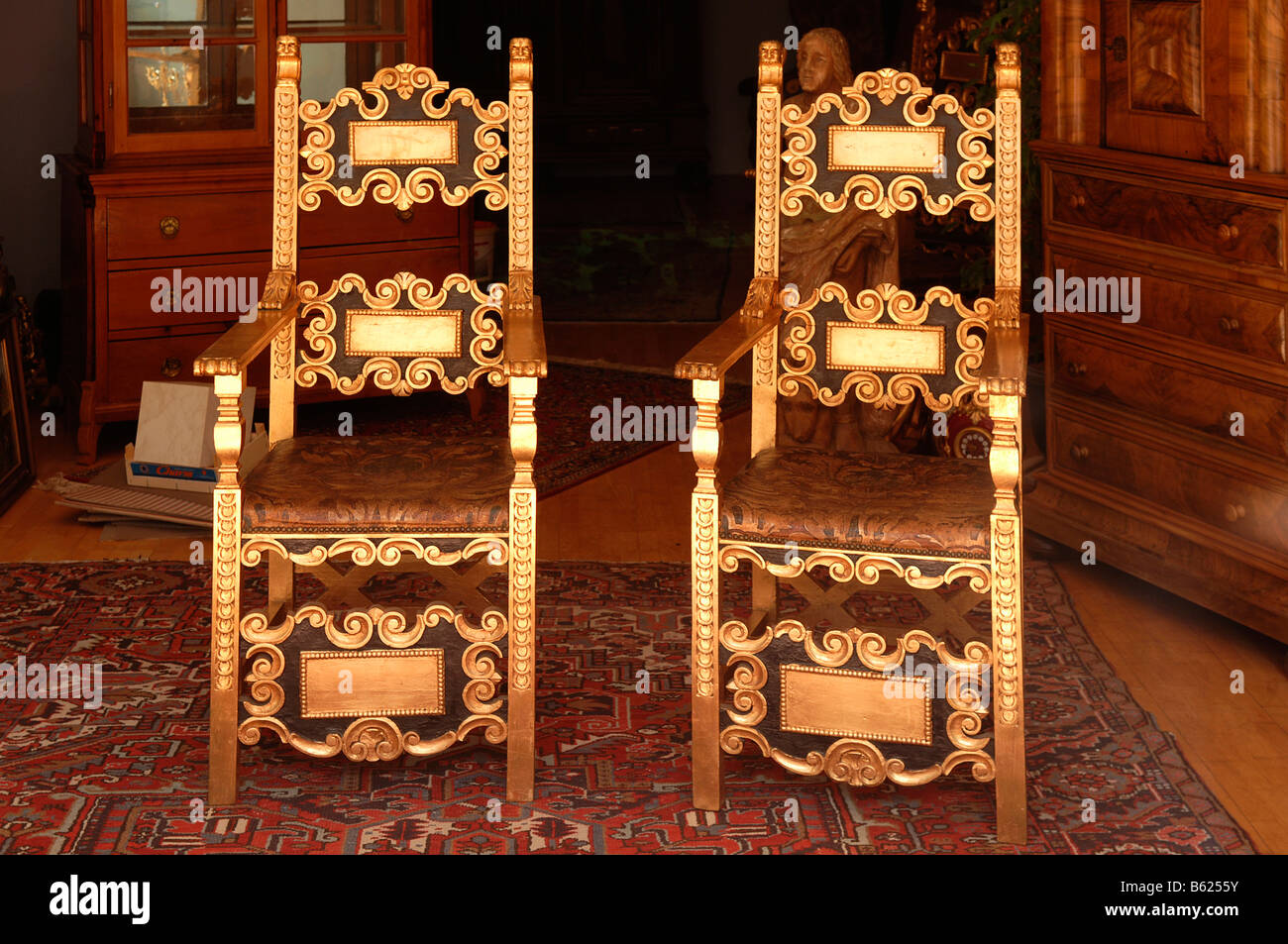 Two gilded old armchairs in an antique shop, Nuremberg, Middle Franconia, Bavaria, Germany, Europe Stock Photo