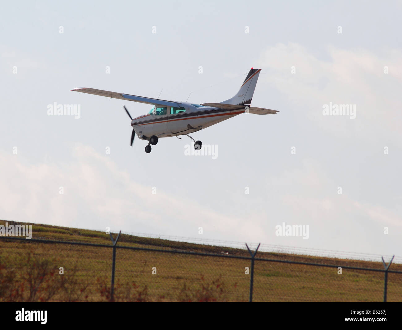 small propeller plane landing at an airport Stock Photo Alamy