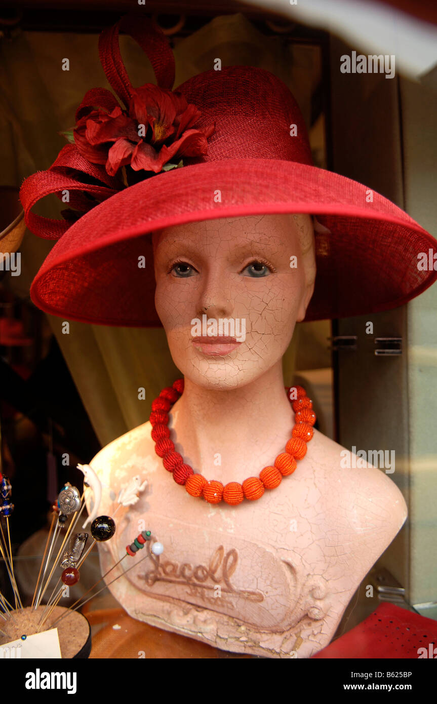 Window dummy wearing a red hat, Rye, Sussex, England, Great Britain