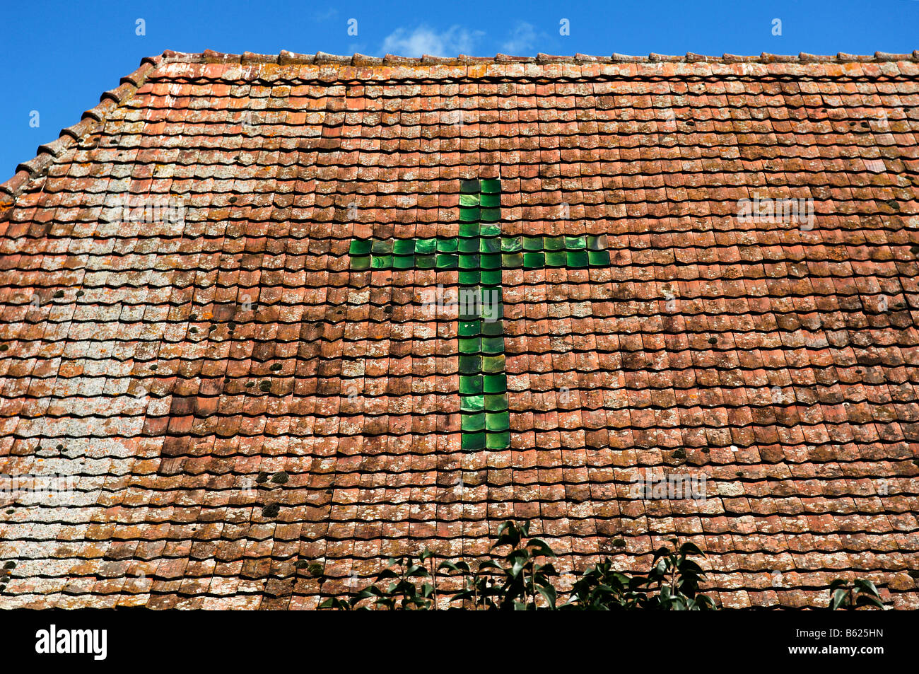 Green 'Schindelkreuz' tile cross, on an old roof, eco-museum, Ungersheim, Alsace, France, Europe Stock Photo