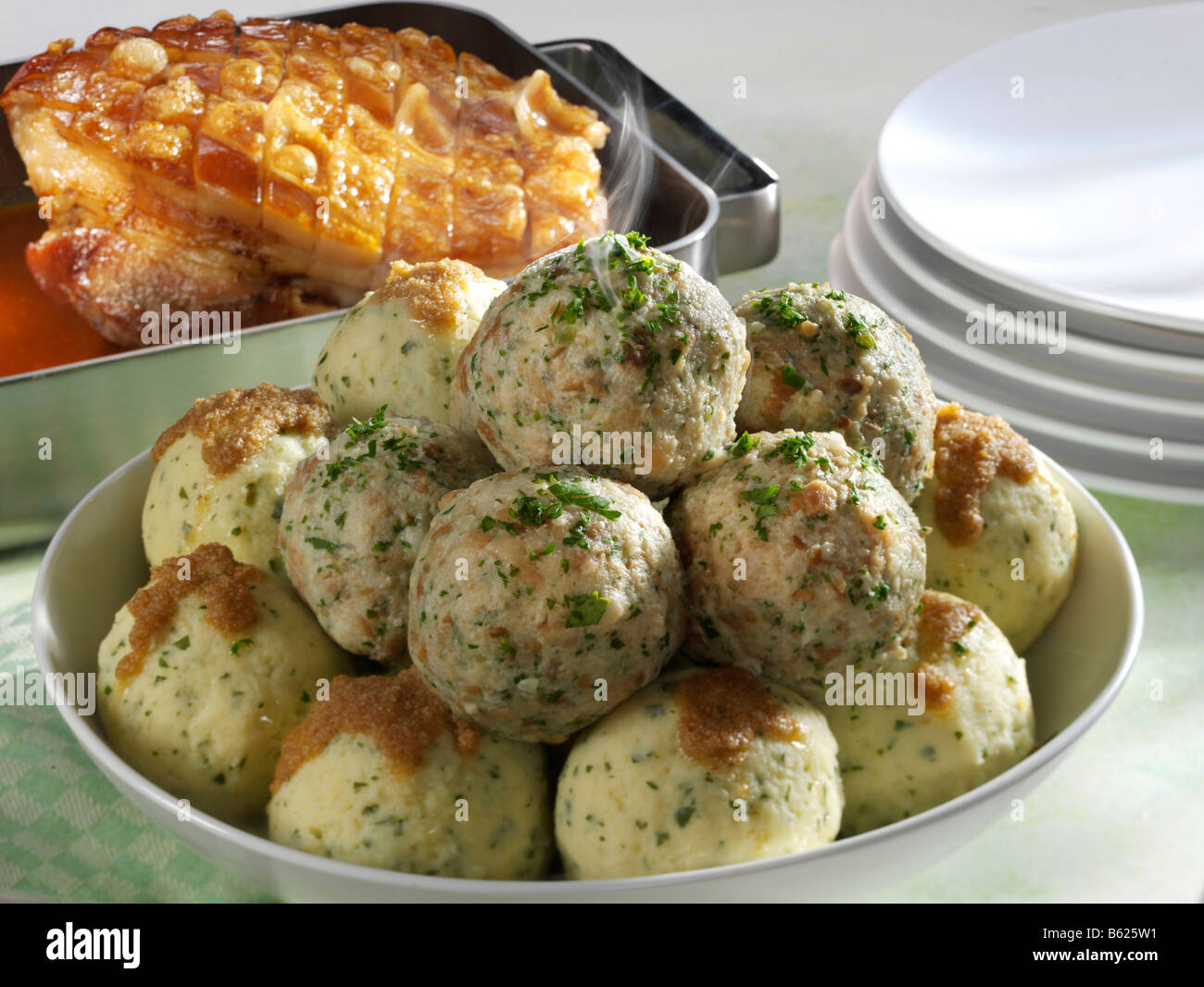 Potato dumplings and bread dumplings with roast pork Stock Photo Alamy