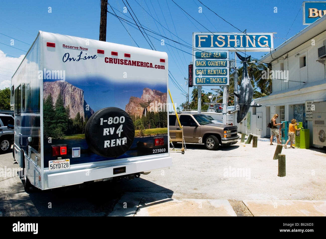 Campervan Woman And Child With A Replica Of A Great White Shark Stock Photo Alamy