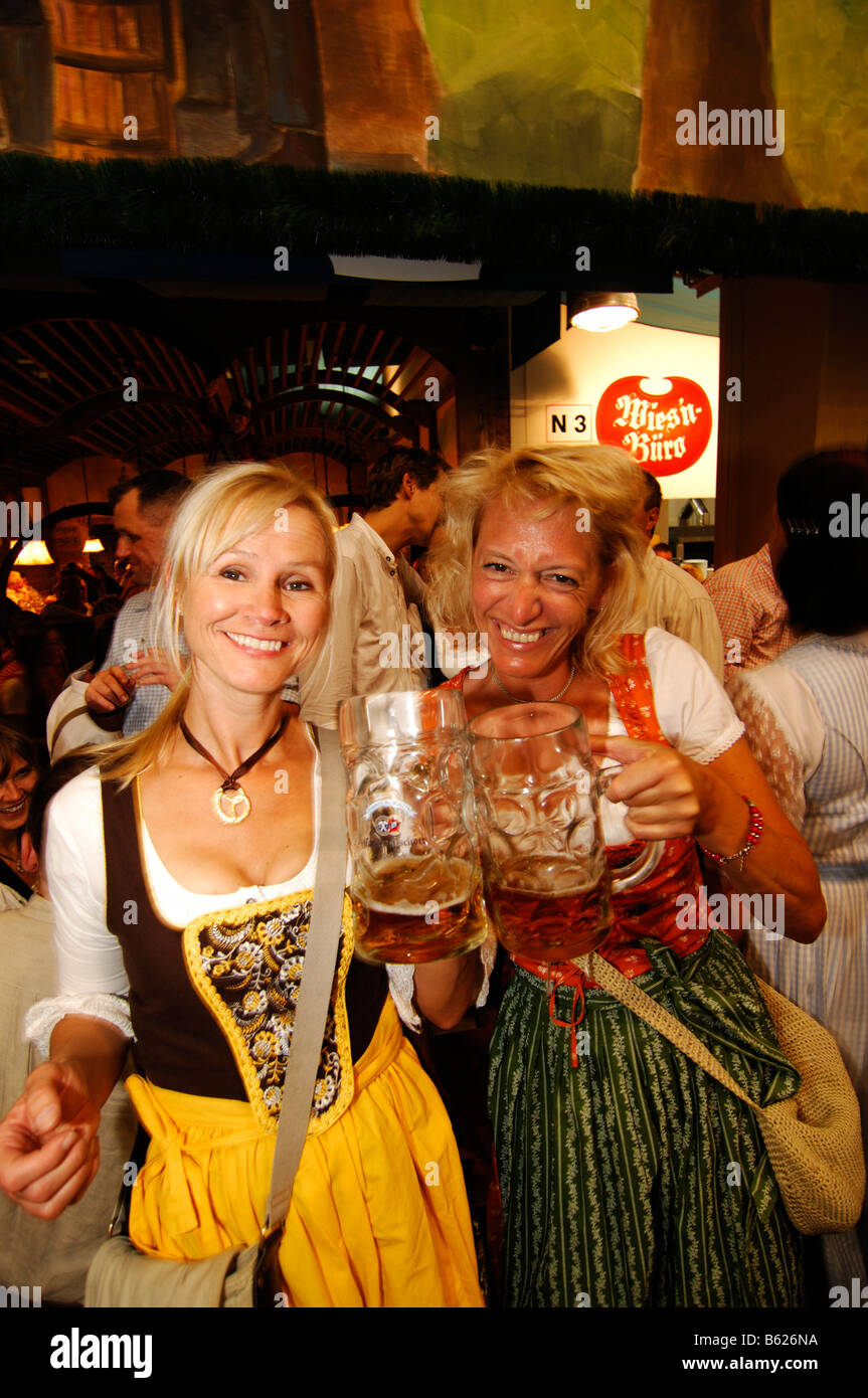 Women wearing a traditional dress, called a Dirndl, in a beer tent at the  Oktoberfest Beer Festival or Wies'n in Munich, Bavari Stock Photo - Alamy