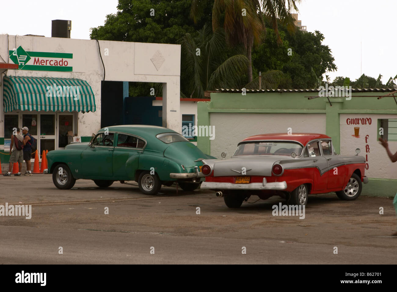 Cuban garage or automobile shop with two american cars, havana, cuba Stock Photo