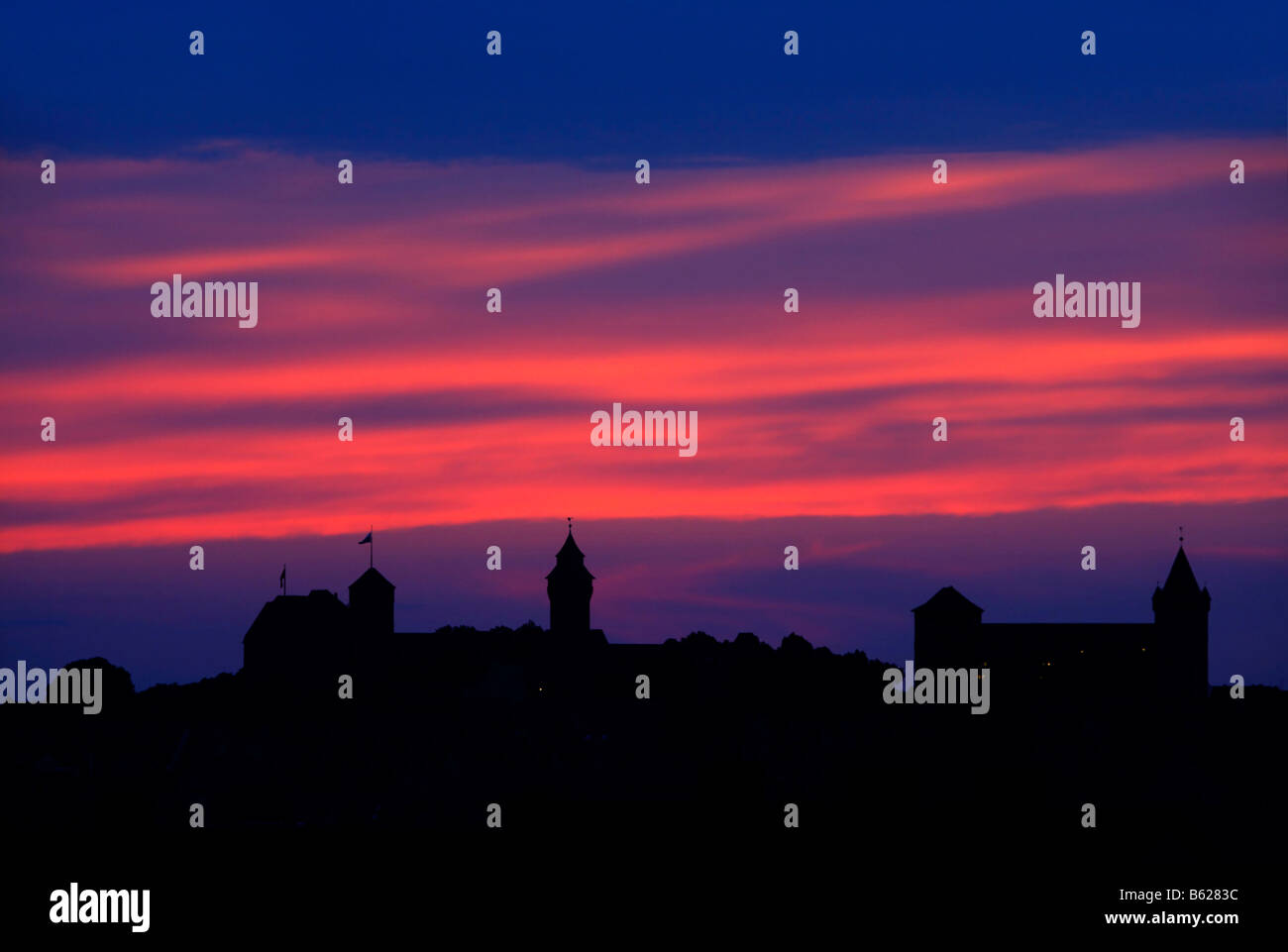 Nuremberg Castle or Kaiserburg, silhouette, red evening sky, historic city centre, Nuremberg, Middle Franconia, Bavaria, German Stock Photo