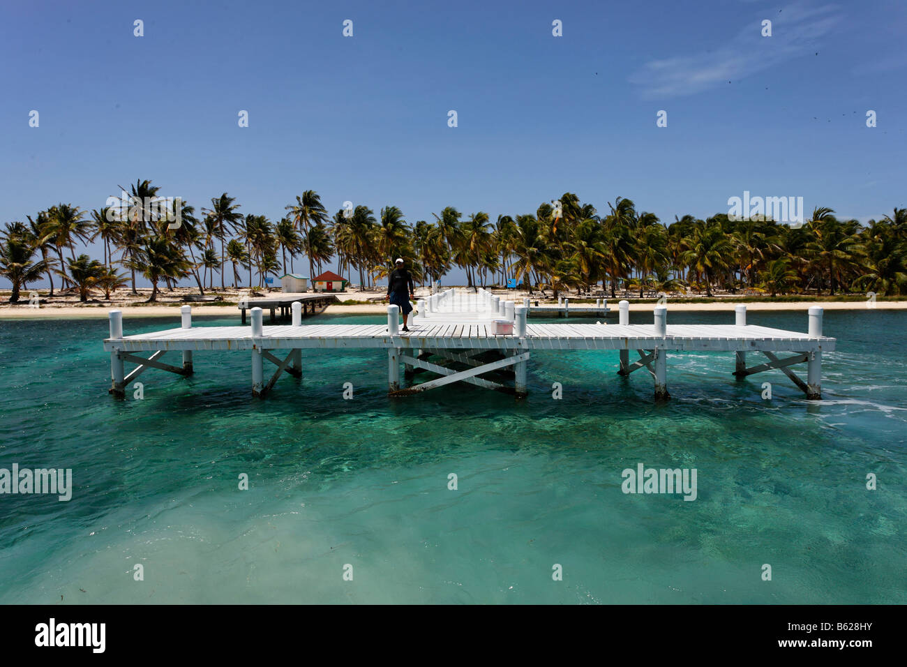 Jetty in front of the island and nature park of Half Moon Cay, Turneffe Atoll, Belize, Central America, Caribbean Stock Photo