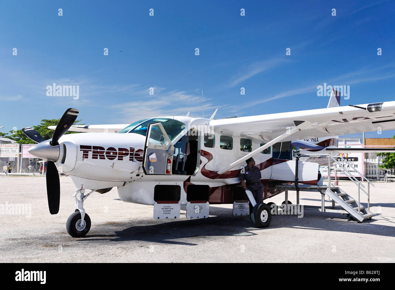 Cessna 208 Caravan with open baggage compartments, Tropic Air, on the local airfield of San Pedro, Ambergris Cay Island, Belize Stock Photo