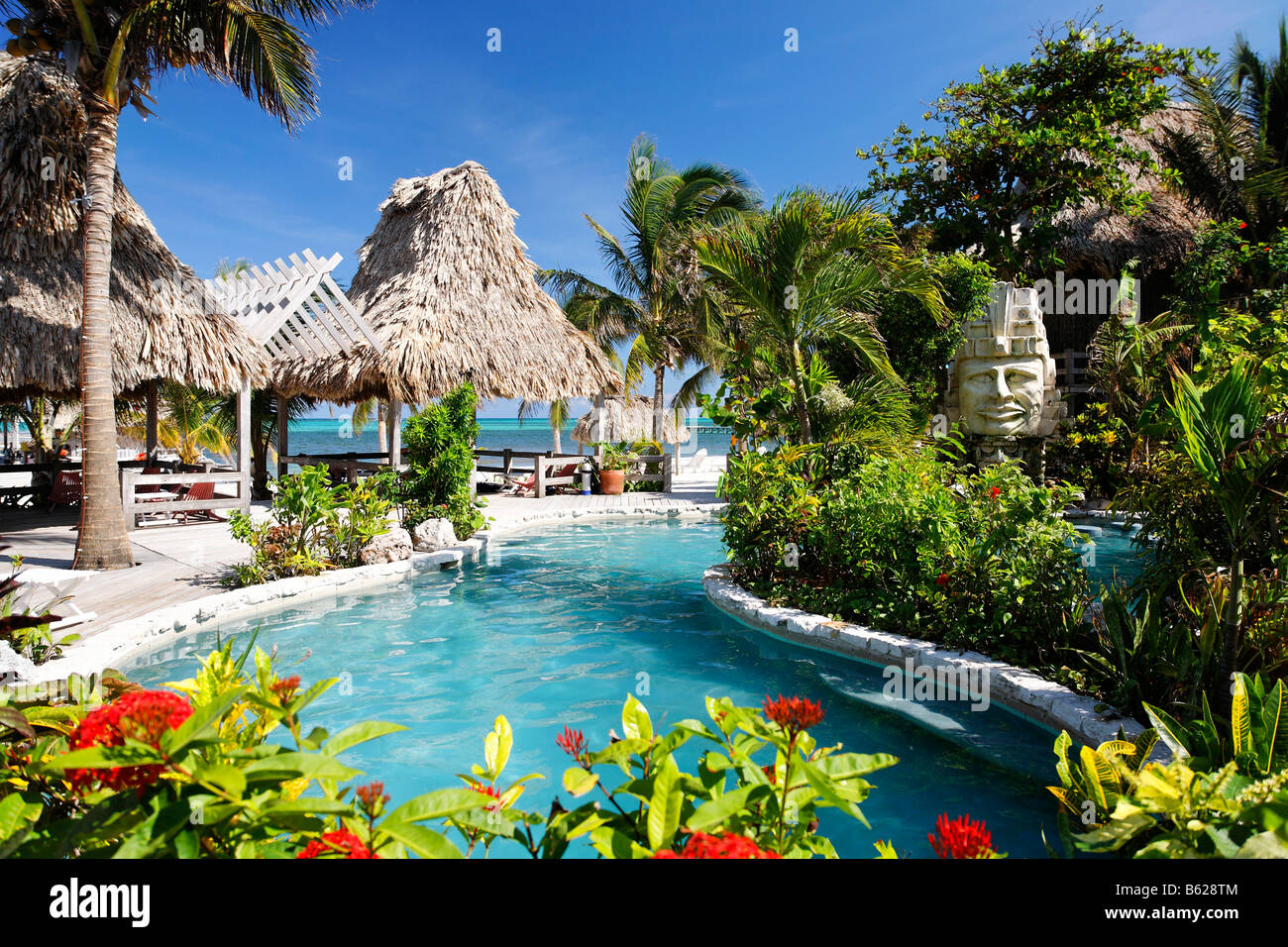 Hotel swimming pool with views onto the ocean, San Pedro, Ambergris Cay Island, Belize, Central America, Caribbean Stock Photo