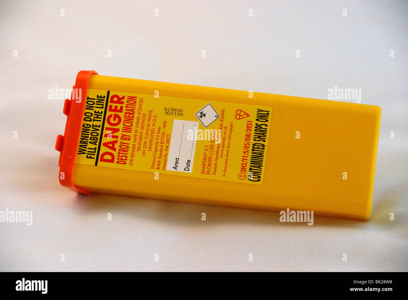 Sharps box used for disposing of used needles Stock Photo Alamy