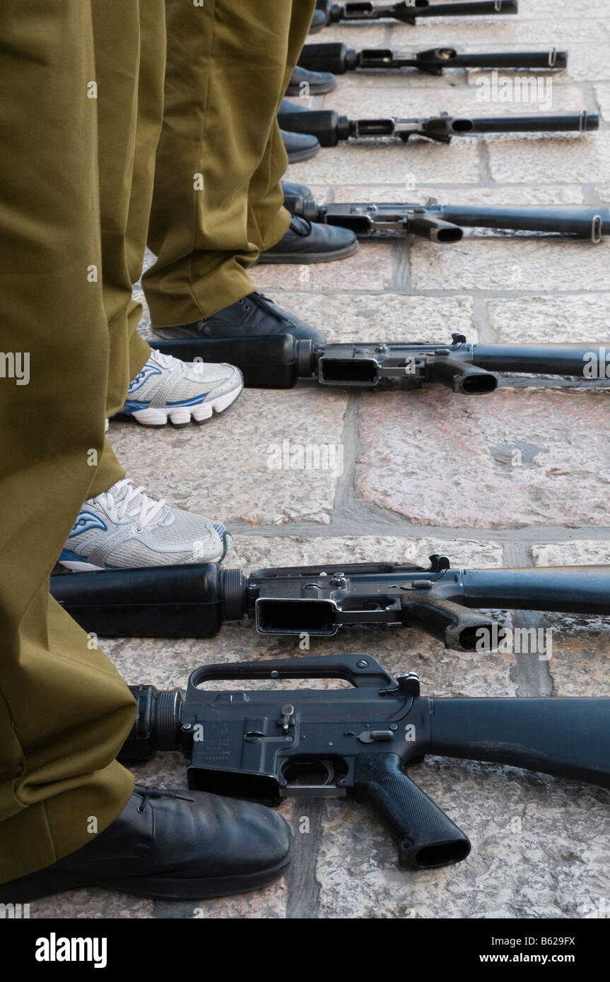 Israel Jerusalem old city Western Wall Oath miltary ceremony close up of row of soldier legs with row of guns Stock Photo