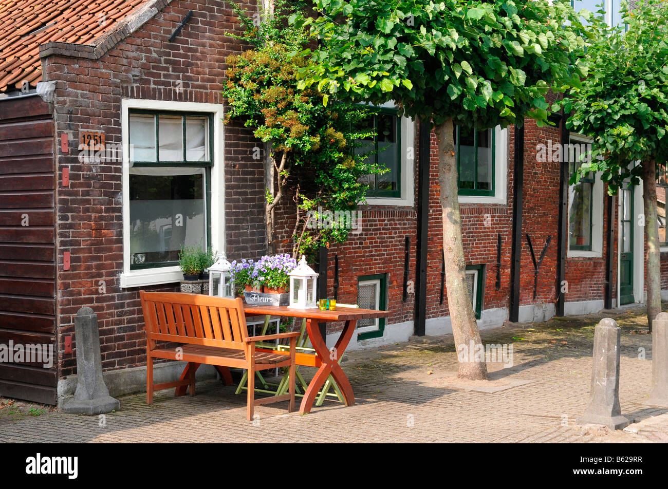 Bench, flowers on table, Sloten, Amsterdam, Netherlands, Europe Stock Photo