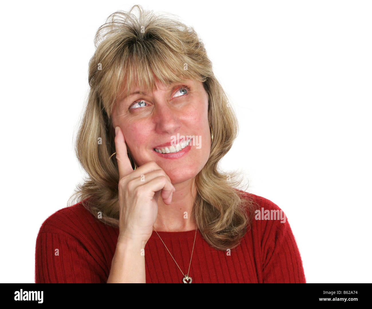 Blond mature woman thinking Cut Out Stock Images & Pictures - Alamy