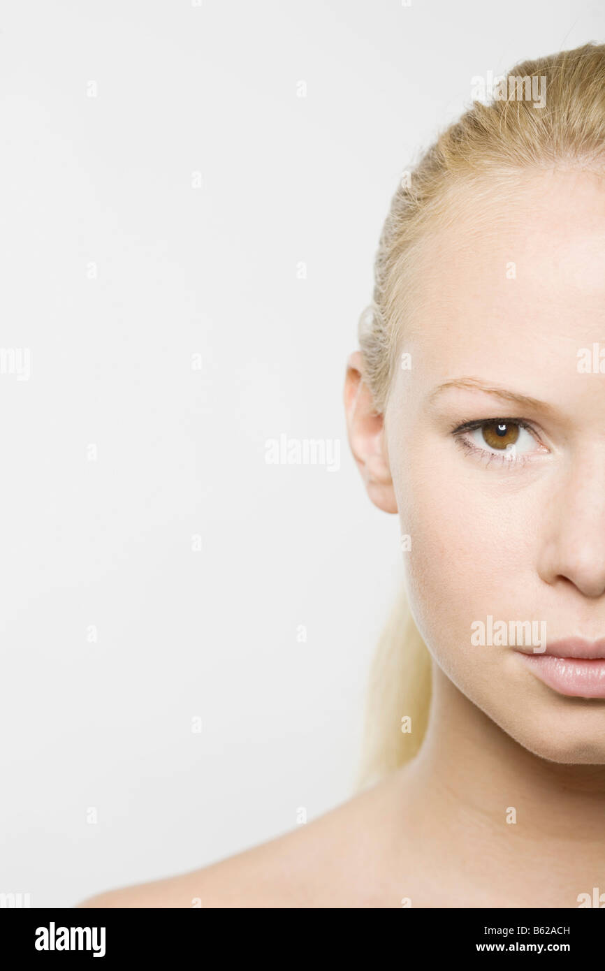 Portrait of the right half of the face of a young blonde woman Stock Photo