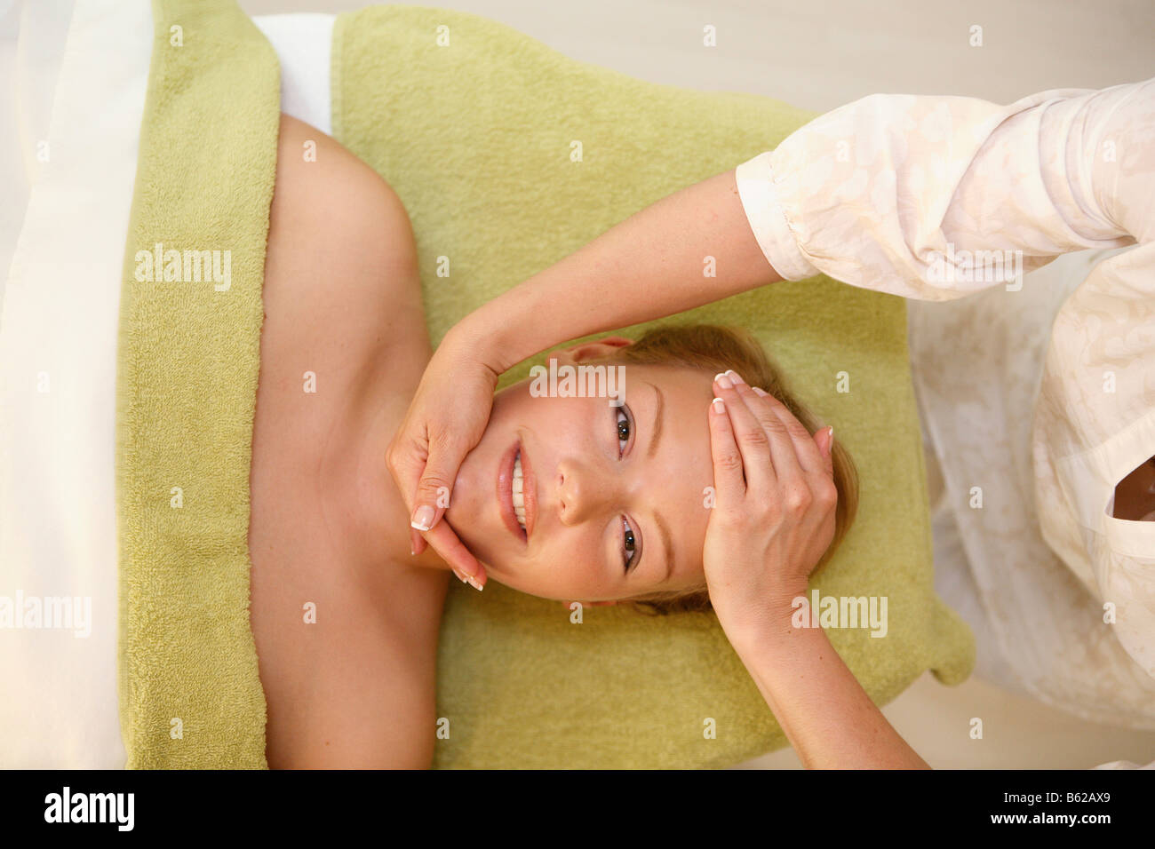 Girl getting a facial in a beauty parlour Stock Photo