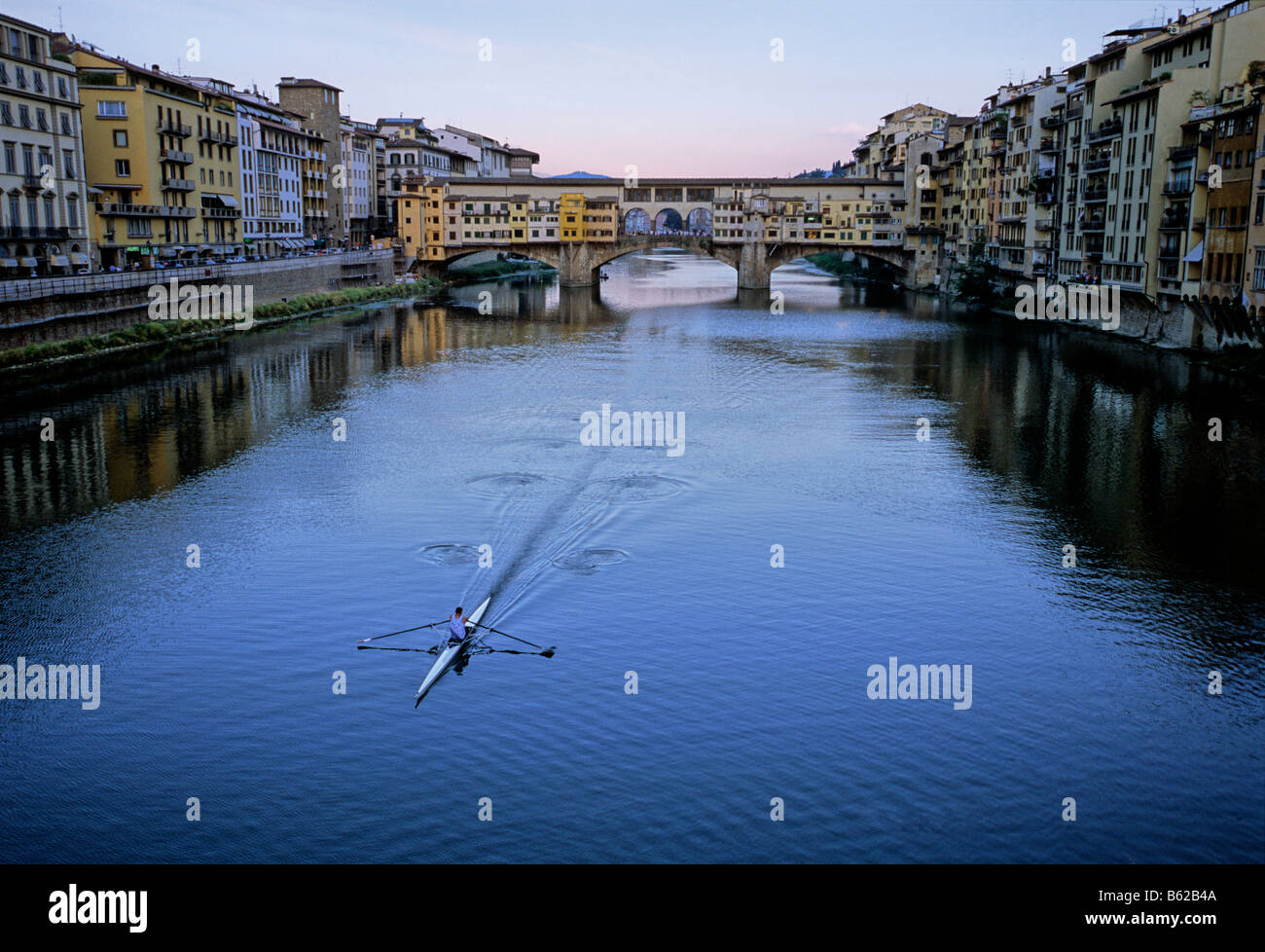 Rower on the Arno River in front of Ponte Vecchio Bridge, Florence, Firenze, Tuscany, Italy, Europe Stock Photo