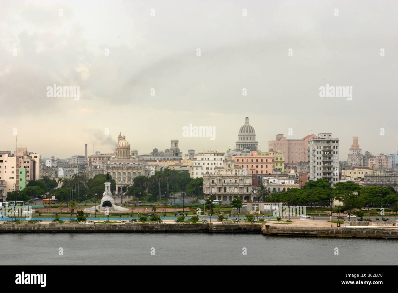 The havana skyline from across the canal de entrada. In the foreground and to the left is a statue of Maximo Gomez. Stock Photo
